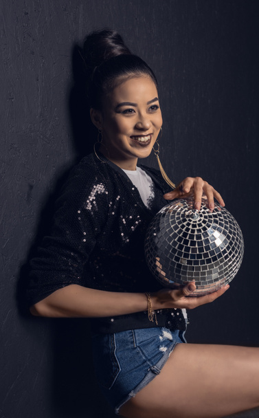 glamour asian girl with disco ball   - Φωτογραφία, εικόνα