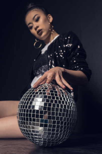 glamour asian girl with disco ball   - Foto, Imagen