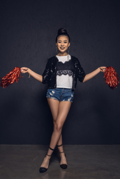 Young woman with pom-poms  - Photo, Image