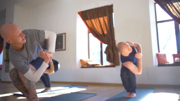 Group of people does the yoga exercise in the room slow motion - Imágenes, Vídeo