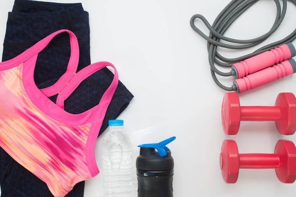Flat lay of sport clothing and equipments on white background, H - Photo, Image