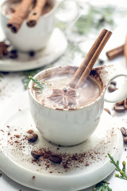 Coffee cup with smoke, anise star and cinnamon sticks, selective focus - Zdjęcie, obraz