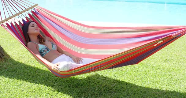 Calm young woman in hammock - Footage, Video