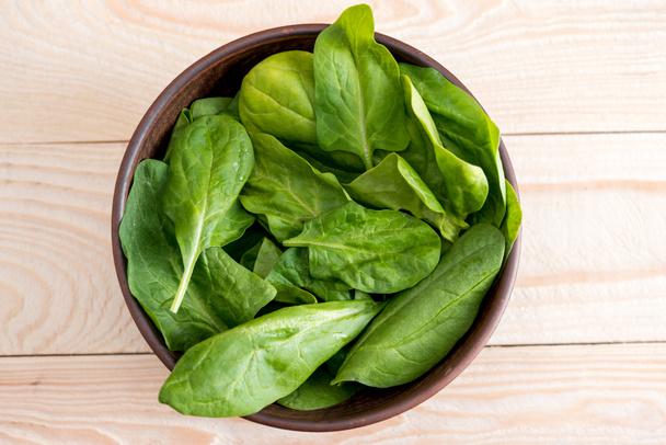 spinach leaves in ceramic bowl  - Photo, Image