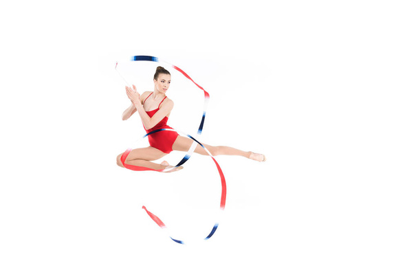 woman rhythmic gymnast jumping with rope - Photo, Image