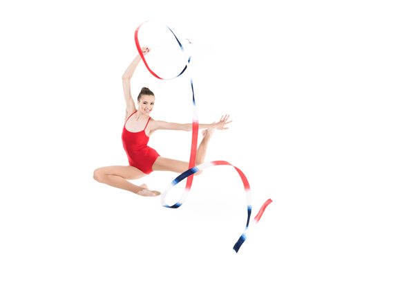 woman rhythmic gymnast jumping with rope - Photo, Image