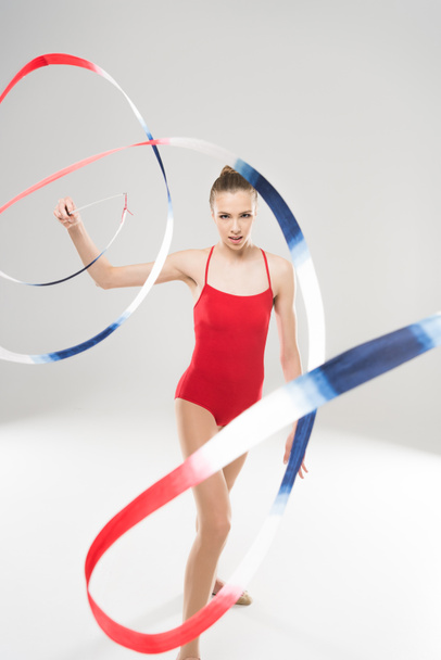 woman rhythmic gymnast exercising with rope - Foto, afbeelding