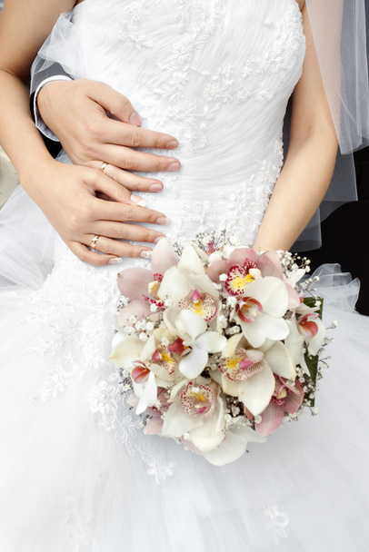 Part of bride with bouquet of flowers - Photo, Image