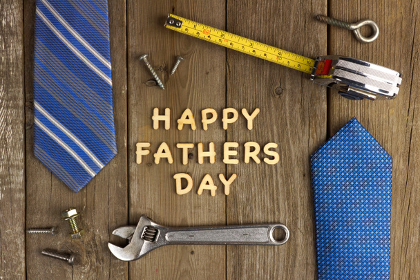 Happy Fathers Day letters with tools and ties frame over wood - Photo, Image