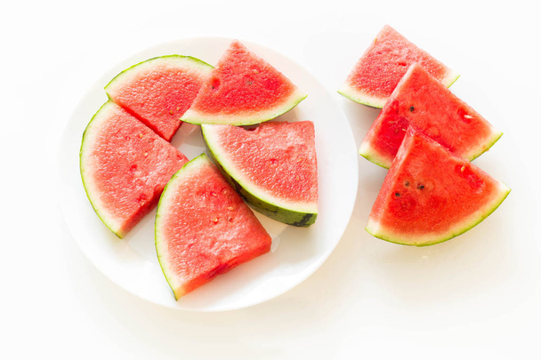 Juicy watermelon on a plate isolated on a white background. - Fotografie, Obrázek