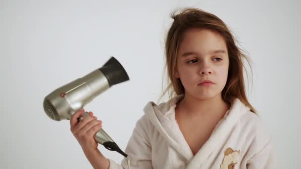 girl in bathrobe drying hair  - Materiał filmowy, wideo