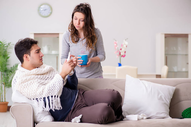 Wife caring for sick husband at home - Фото, зображення