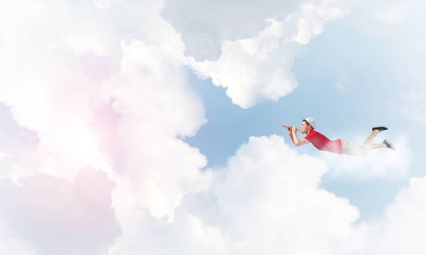 Young cheerful man flying  - Valokuva, kuva