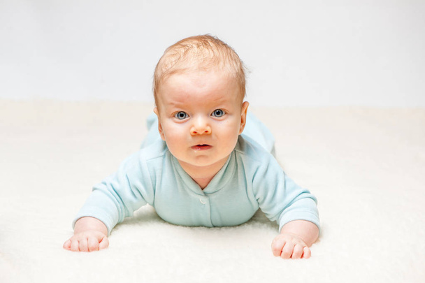 baby lying on beige cover  - Photo, Image