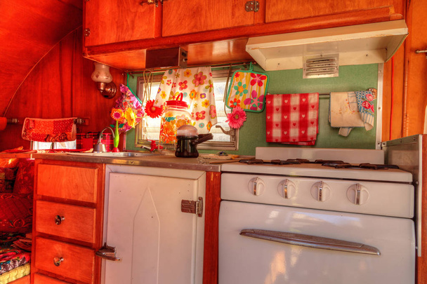 Small retro caravan camper used as a tiny house on road trips - Photo, Image