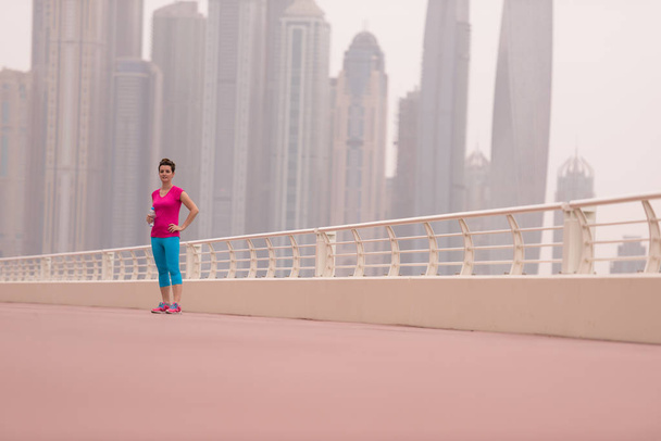 woman running on the promenade - Фото, изображение
