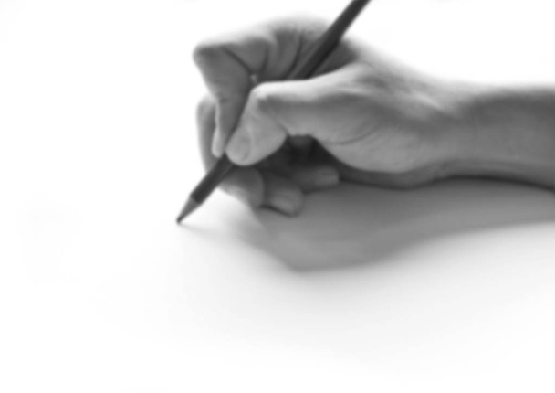 Blur image of Pencil in hand on paper arts with shadows. - Фото, изображение