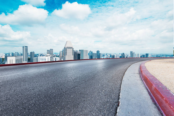 empty road with cityscape of modern city - Photo, Image