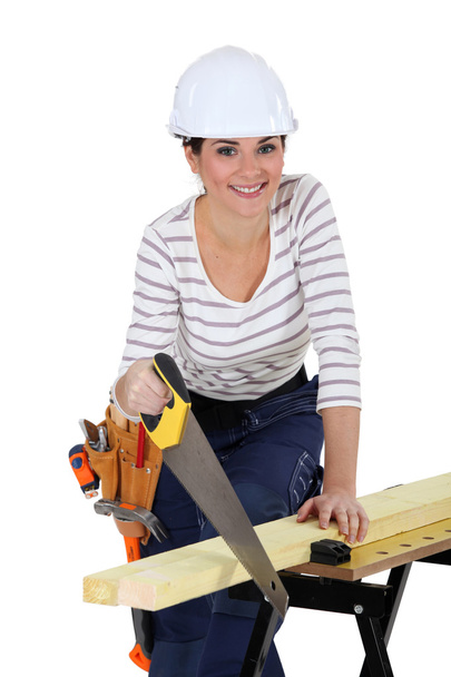 Woman sawing wood - Фото, зображення