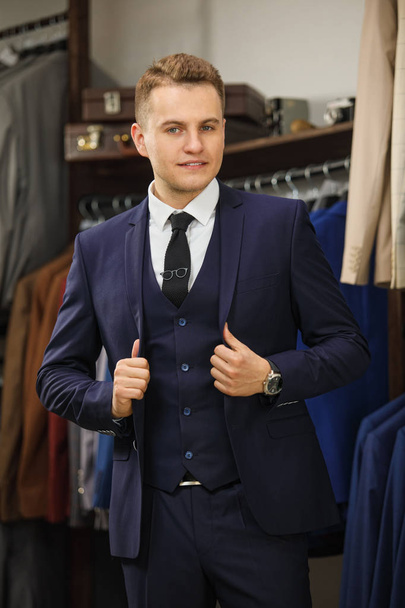 Handsome elegant young fashion man in classical costume suit. Advertising photo - Valokuva, kuva