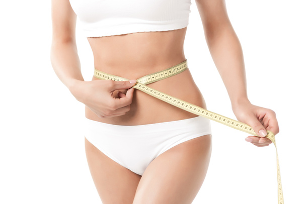 woman measuring her waistline - Photo, Image