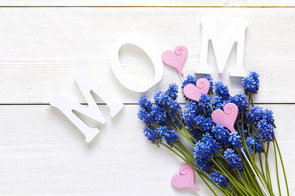 Mothers day background with  with blue muscaries flowers on whit - Foto, immagini