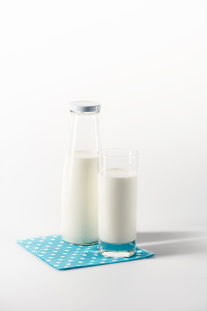 milk in glass and bottle on napkin - Photo, Image