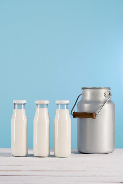 glass bottles of milk with can - Photo, Image