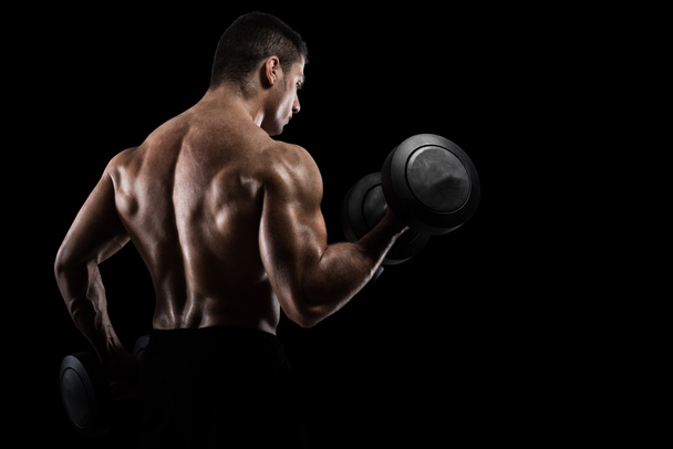 Lekkoatletycznego mięśni mężczyzna treningu bicepsów  - Zdjęcie, obraz