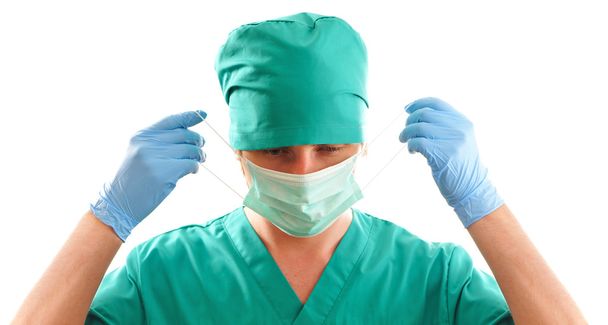 Pulling on surgical mask - Foto, immagini