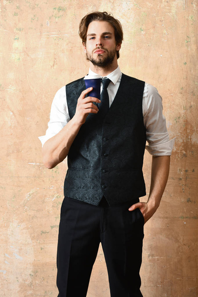 morning coffee, young serious business man holding paper cup - Foto, Imagen