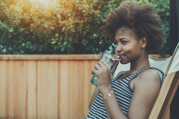 Cute black teenage girl with mojito coctail - Foto, afbeelding