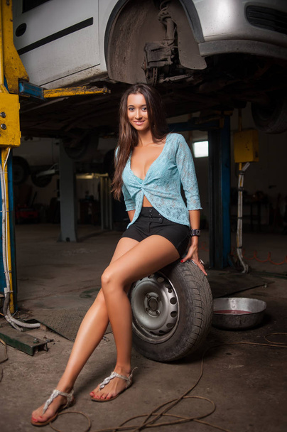 Sexy beautiful girl in the auto repair shop - Φωτογραφία, εικόνα