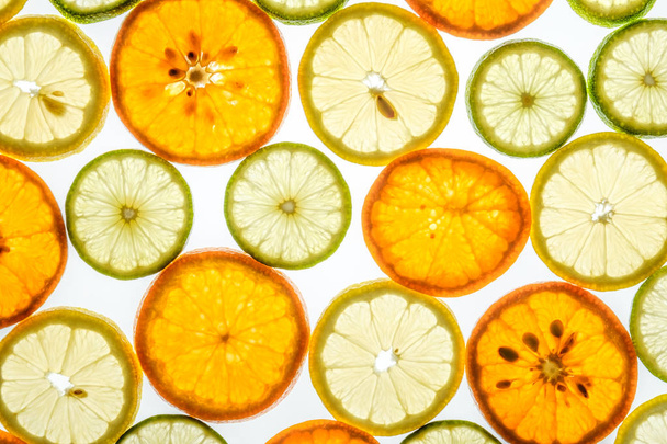 Bright mandarin, lemon and lime slices on white - Φωτογραφία, εικόνα