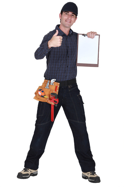 Man with clip-board giving thumbs-up - Foto, afbeelding