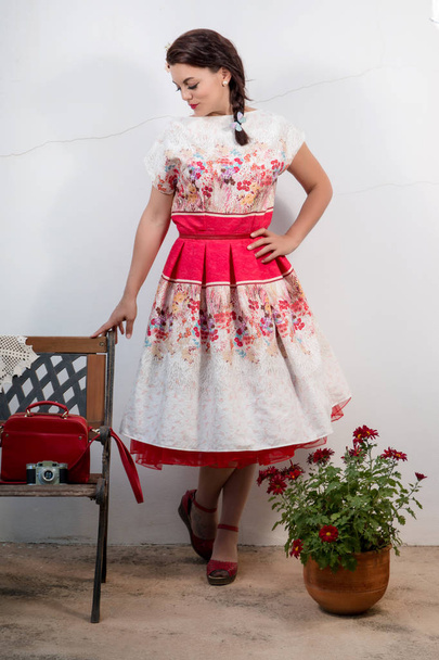 Vintage girl with floral dress - Foto, imagen