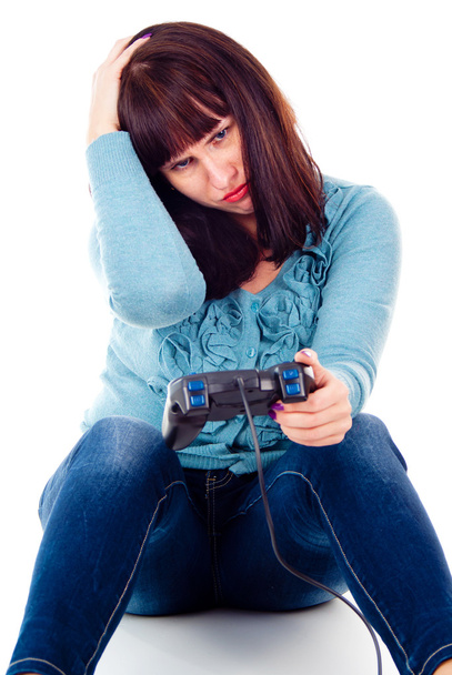 A girl playing video games, defeat - Φωτογραφία, εικόνα