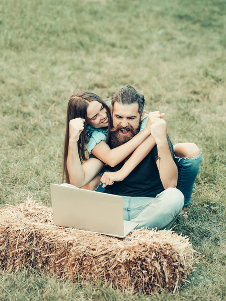friends, brother and sister, happy woman, man winner with laptop - Photo, Image
