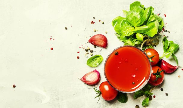 Tomato juice with green basil and spices - Foto, imagen
