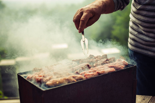 BBQ. Closeup of barbecue grilling picnic in backyard outdoor - 写真・画像