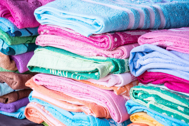 Multicolored fabric in outdoor market, colorful mixture of towel - Photo, Image