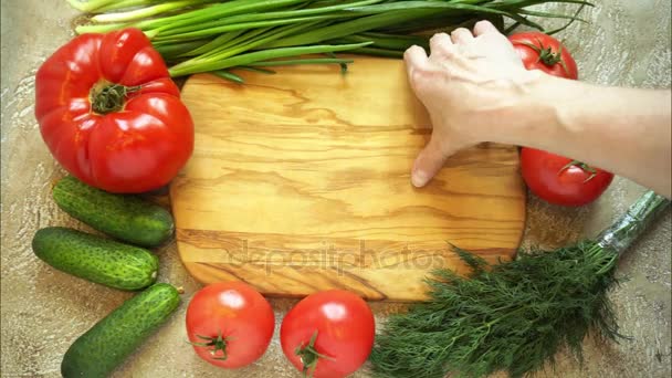 hands made a frame from vegetables around the cutting board, then remove the board and then remains the food background with copy space for your text - Footage, Video