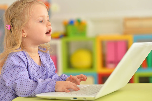little girl using modern laptop - Foto, Bild
