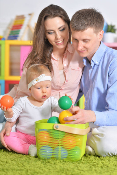 Happy parents playing with daughter - Zdjęcie, obraz