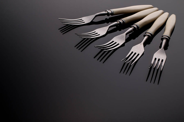 Set of forks. Five  pieces.  On  gray background - 写真・画像