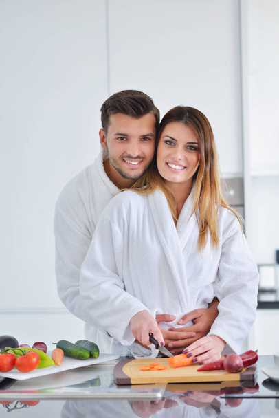 Couple cooking breakfast together - Photo, Image