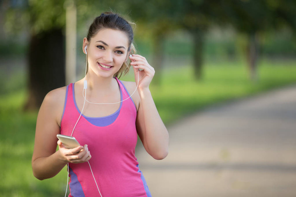 Young lady jogging in a park  - Photo, Image