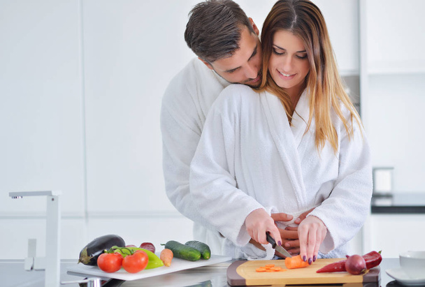 Couple cooking breakfast together - Photo, image