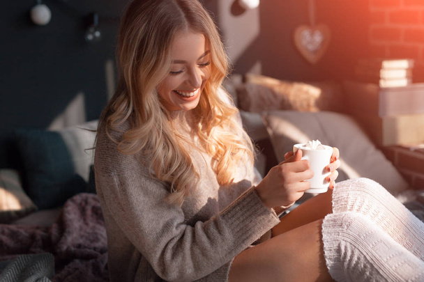 Lovely girl at home with coffee - 写真・画像