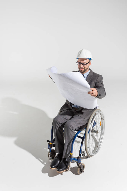 disabled architect with blueprint - Photo, Image